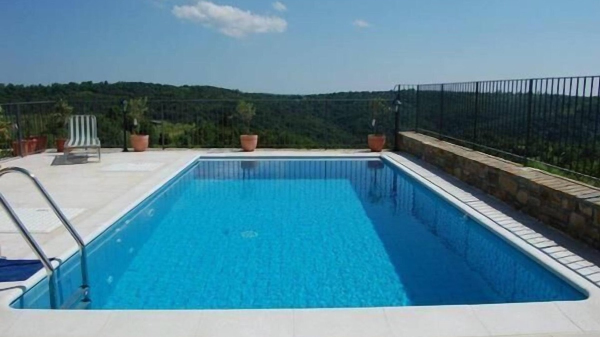 Bric House | Holiday home in a quiet location with pool and far-reaching views