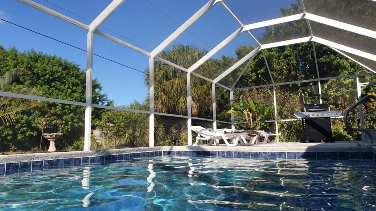 Port Charlotte Villa | Holiday villa with an extra large heated private pool and terrace area
