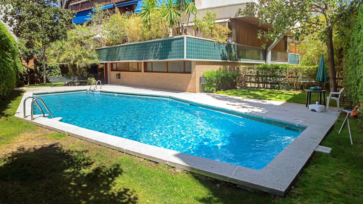 Nueva Espana Apartment | Homerez - Studio for 2 ppl. with shared pool, garden and terrace at Madrid
