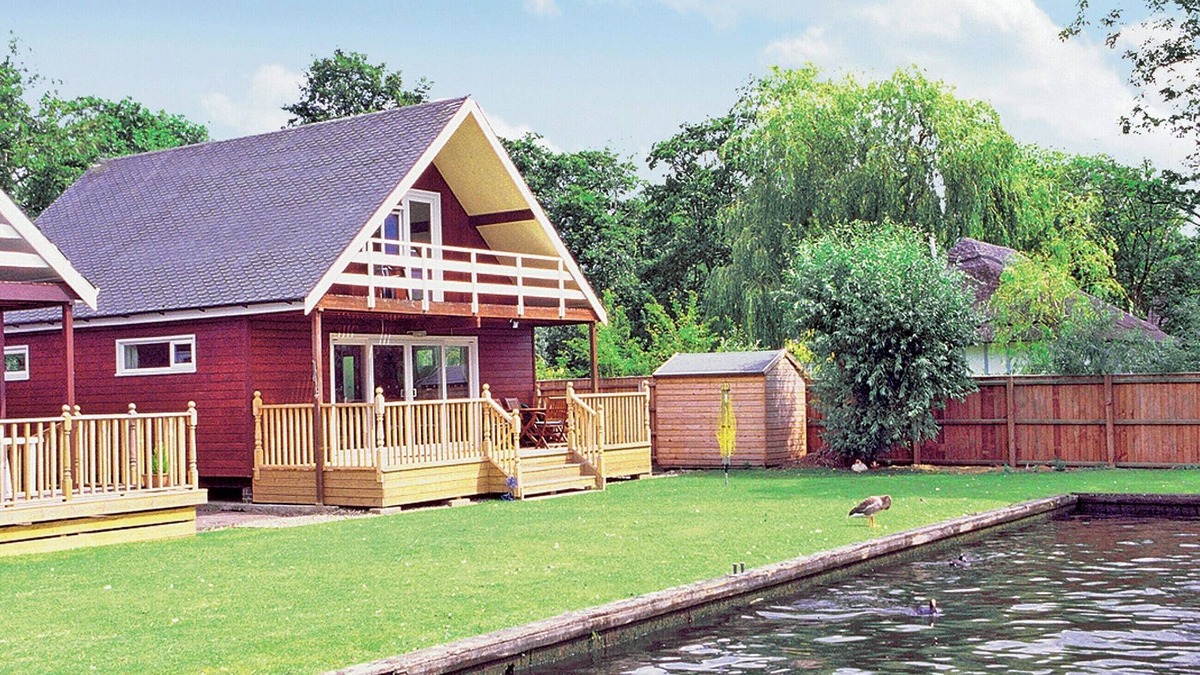 Wroxham Cottage | Imagine relaxing on the patio, watching the boats and river life pass by.