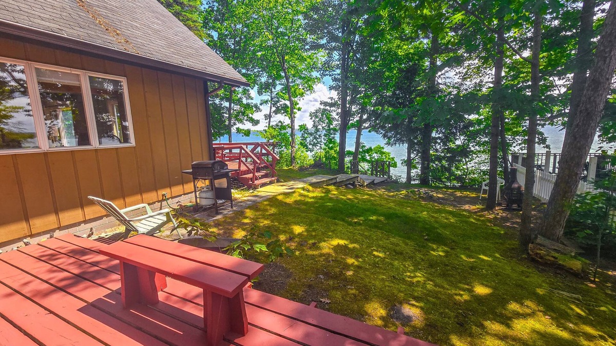Indian River House | Incredible lakefront retreat with dock, fire pit, decks, yard, & amazing views