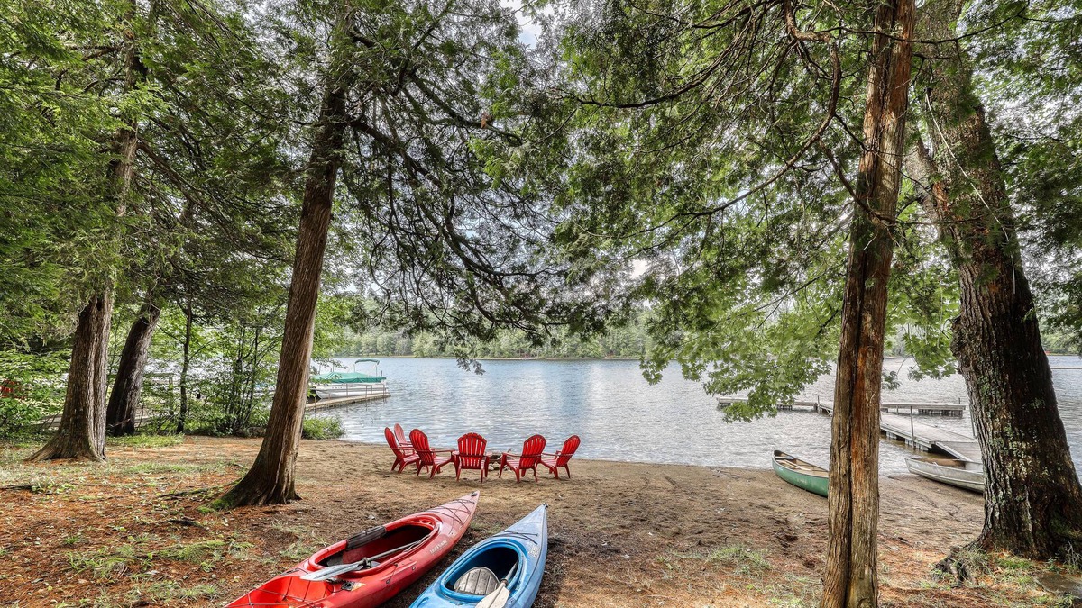 Adirondack House | Inviting lakefront house with dock, sandy beach & screened porch
