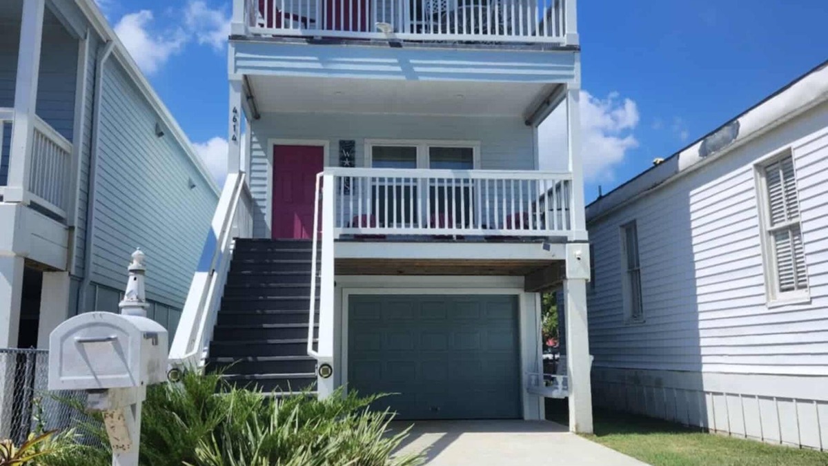 Galveston House | Island House two bedrooms two bath sleeping in the living room golf cart