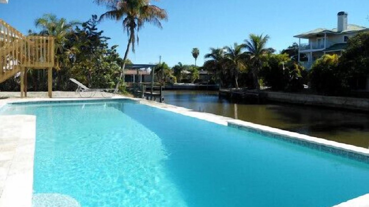 Fort Myers Beach Villa | Island Villa with 33 Foot Infinity Pool, Dock and Boat Access, Dolphin Visits
