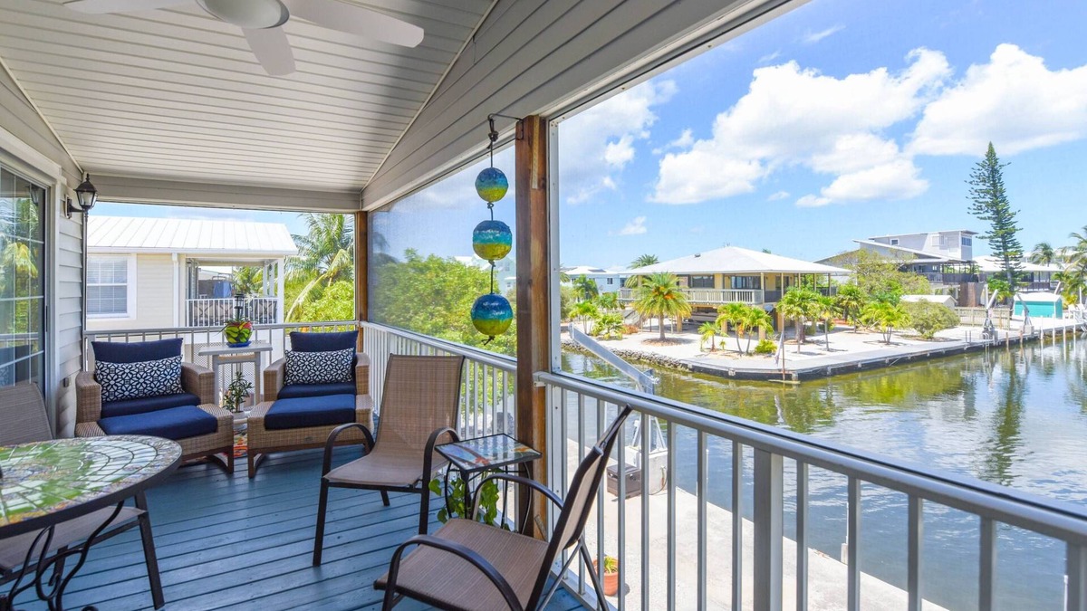 Breezeswept Beach Estates House | Key Blessing: Experience the Keys Life at This Charming 3BR Canal Front Home, Dockage & Dog-Friendly