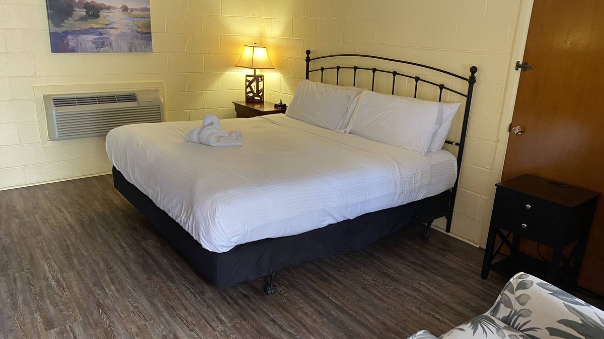 Mount Ida Apartment | King Guest Room located at the Joplin Inn at the entrance to Mountain Harbor, just 2 1/2 miles from Lake Ouachita. by RedAwning