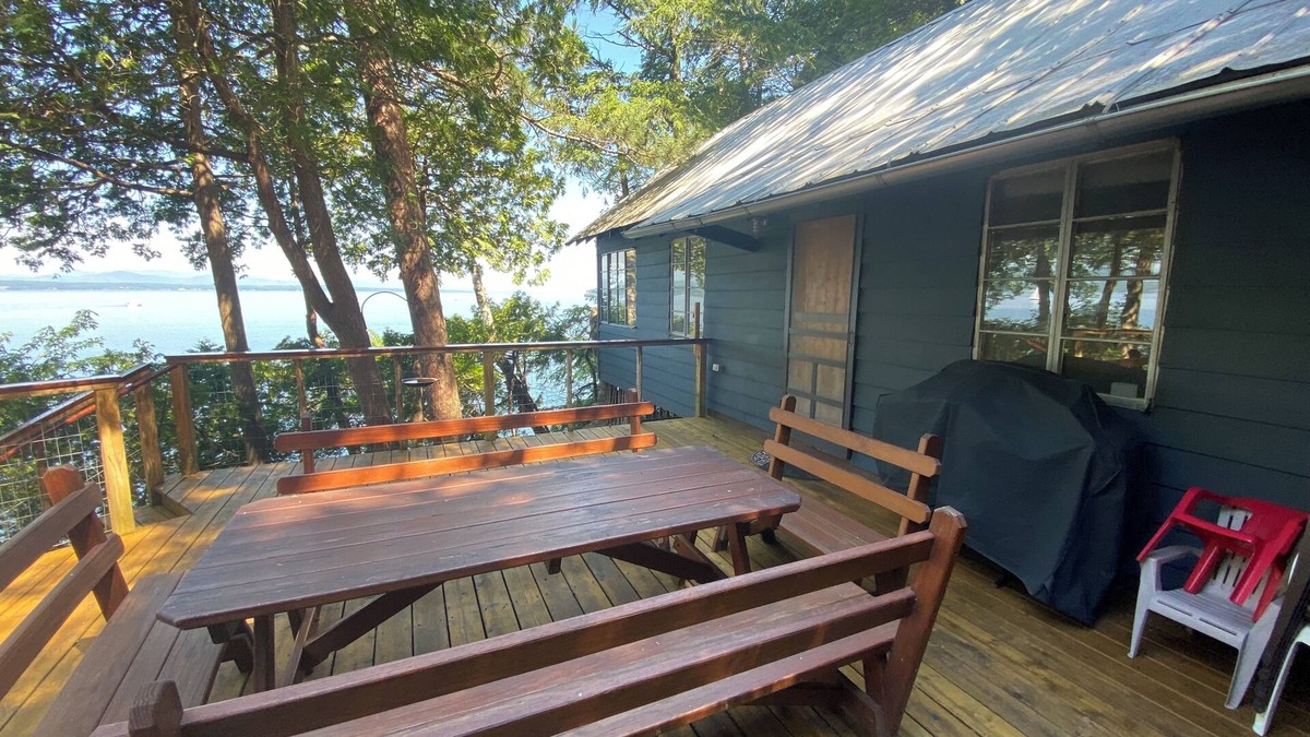 Charlotte Cabin | Lake Champlain camp, spacious deck, sunset & mountain views, beach and dock