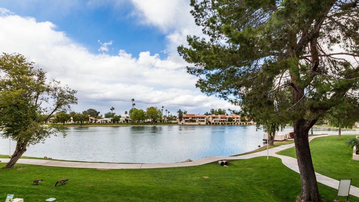 Desert Shores Condo | Lake Front Balcony! Quiet community! Walking path! Restaurants! Heated Pool