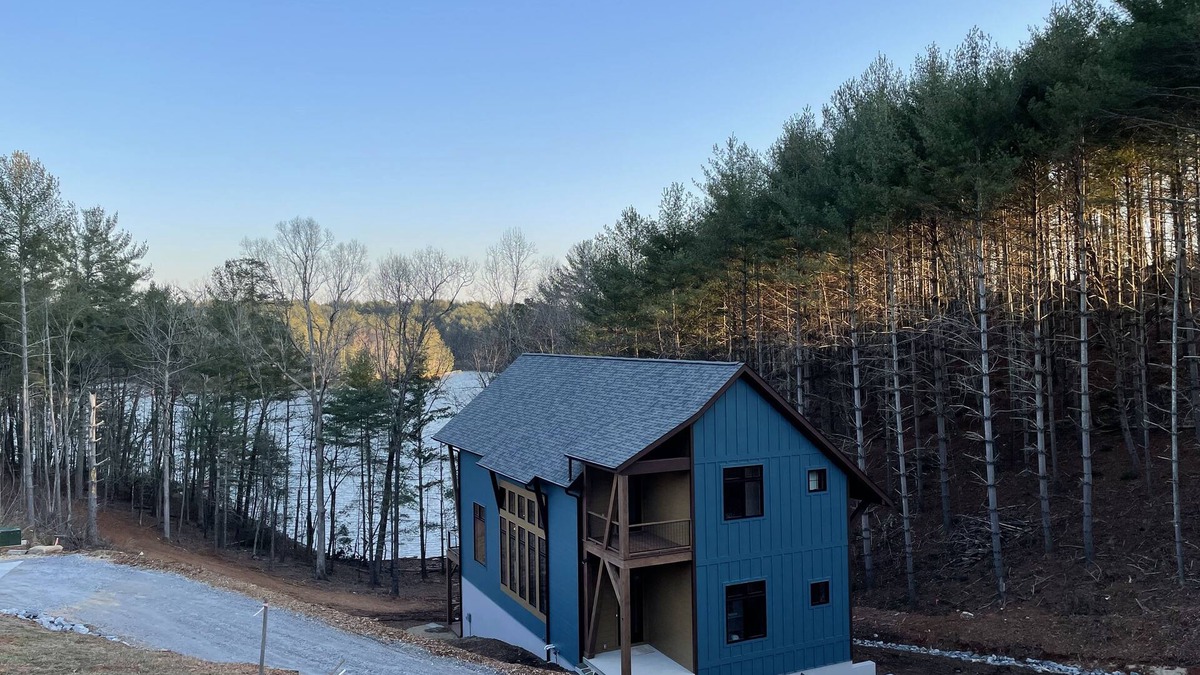 Nebo House | Lake front home with dock in a small cove with a beach.