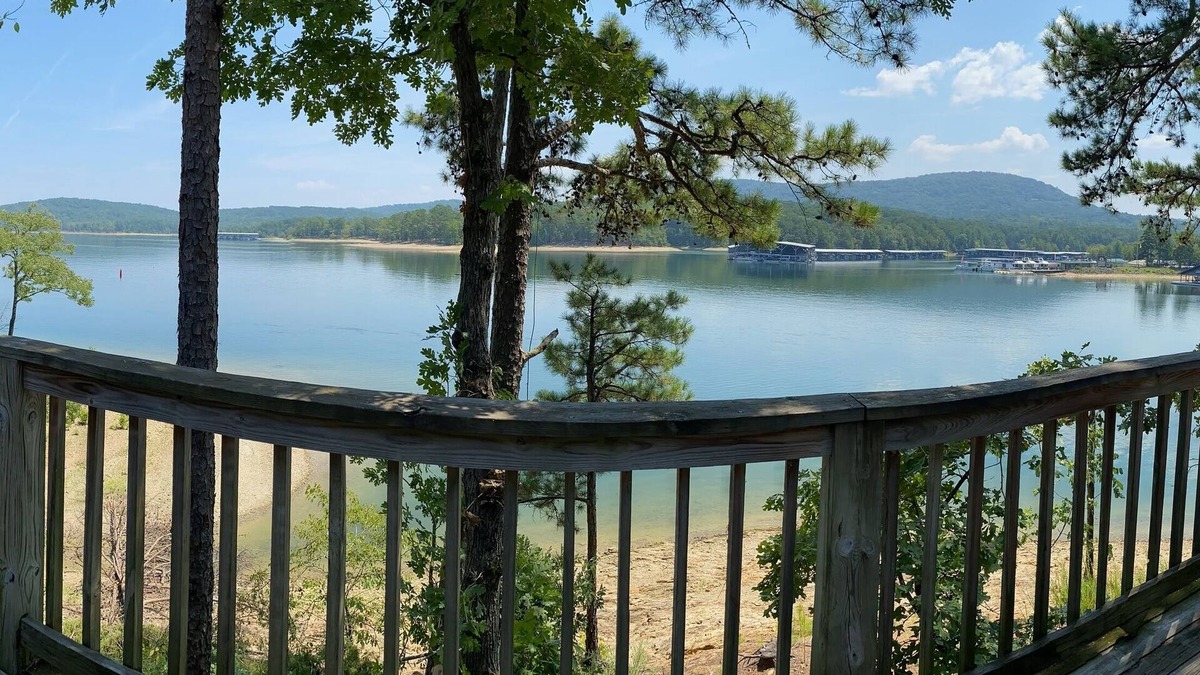 Mount Ida Cottage | Lake view two bedroom, two bath loft, log-sided cottage with private hot tub overlooking Lake Ouachita. by RedAwning