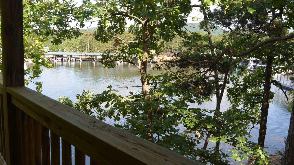 Mount Ida Cottage | Lake view two bedroom, two bath log-sided, luxury Harbor North loft cottage with hot tub overlooking Lake Ouachita. by RedAwning