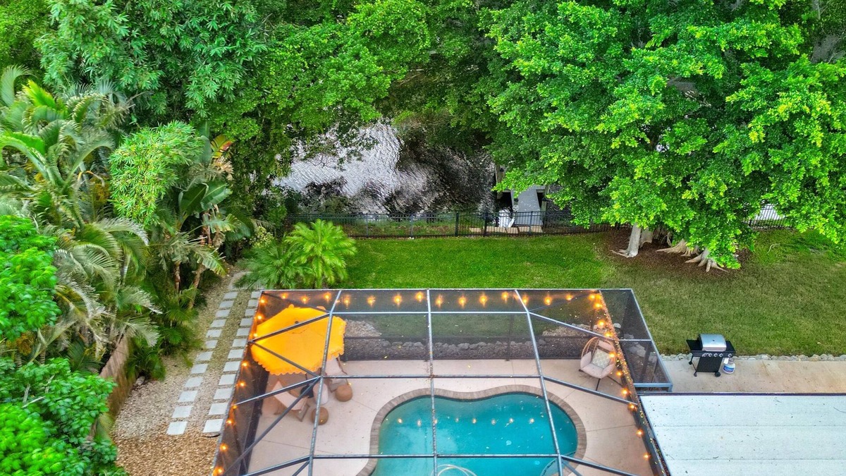 Palma Sola House | Lakefront Escape | Private Dock! Luxurious Pool!