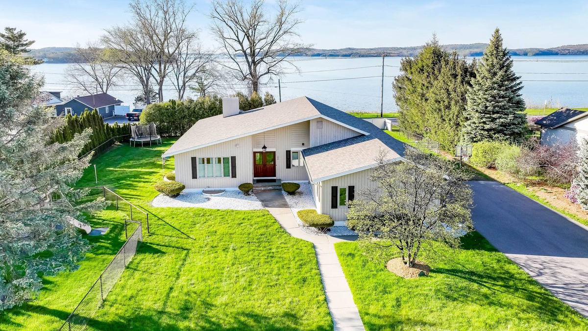 Colchester House | Lakefront home with pool, beach access, central AC, washer/dryer, & fireplace