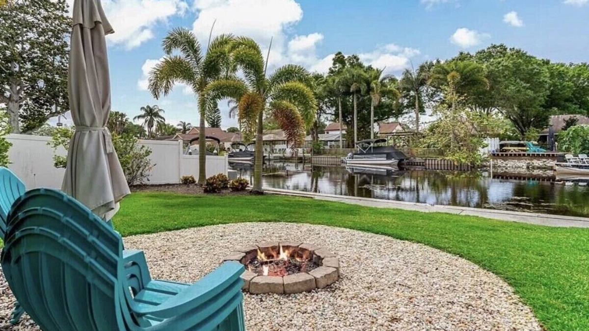 Palm Harbor House | Lakehouse Living w/Firepit and Boat Dock to relax and Enjoy the Sunset