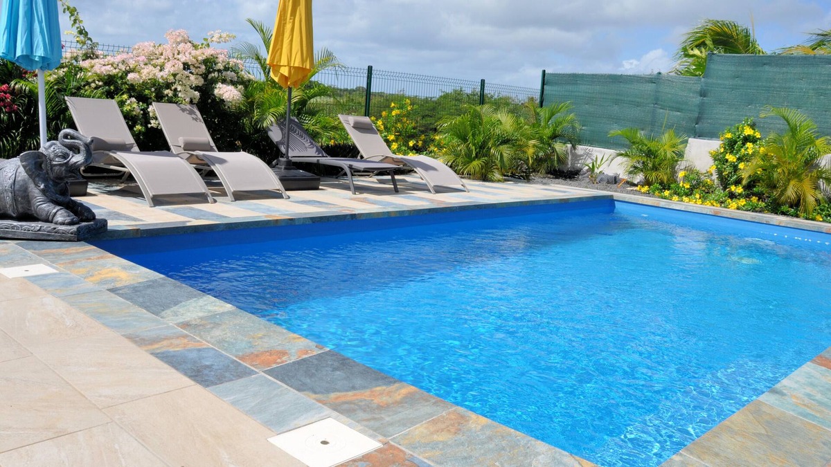 Le Moule Apartment | Lavender apartment, 3 air-conditioned bedrooms, and landscaped swimming pool