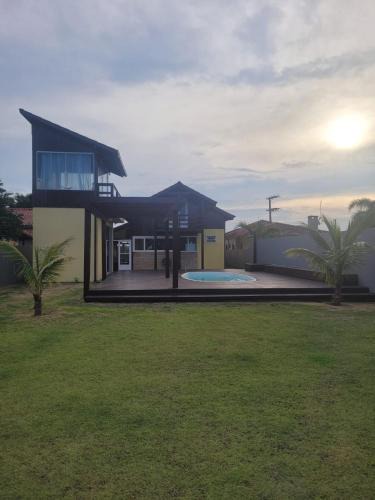 Ibiraquera House | LINDA CASA COM PISCINA DE FRENTE PARA A LAGOA