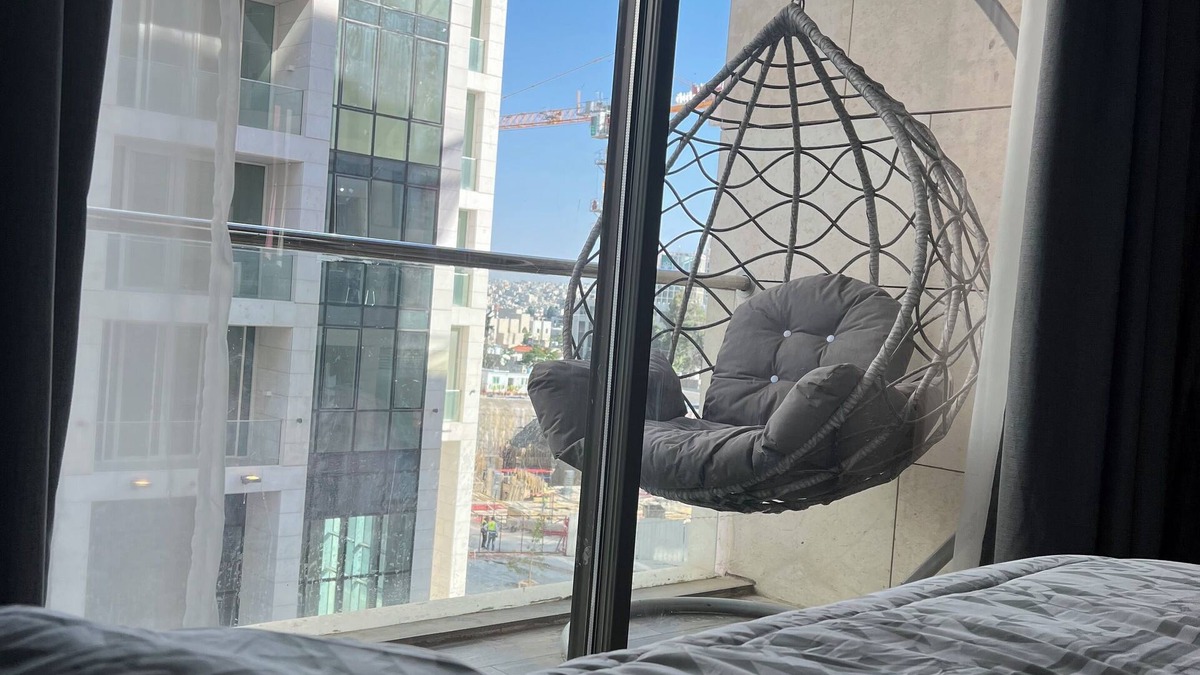 Al Abdali Apartment | Live in the heart of Amman with this luxury one-bedroom suite featuring two balc
