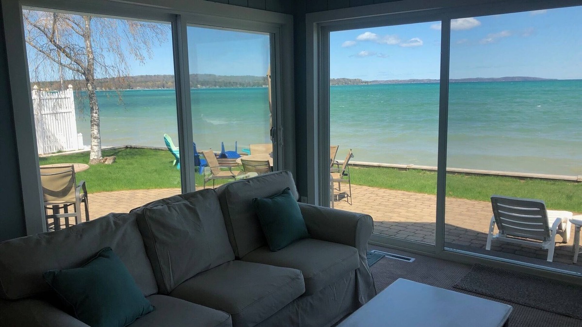 Traverse City House | Located directly on East Grand Traverse Bay with sandy beach