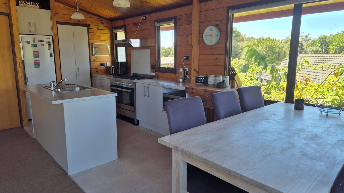 New Plymouth House | Lockwood holiday house, nestled among lush trees.