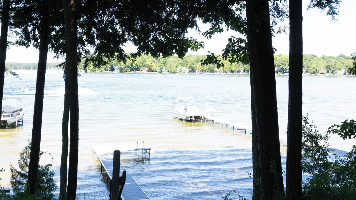Traverse City Cottage | Long Lake Cozy Stone Cottage - Frontage - 4 Kayaks - Fire pit - Pet friendly