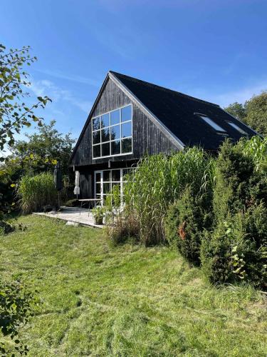 Øer Strand House | Lovely Beach Home Enveloped In Green Surroundings