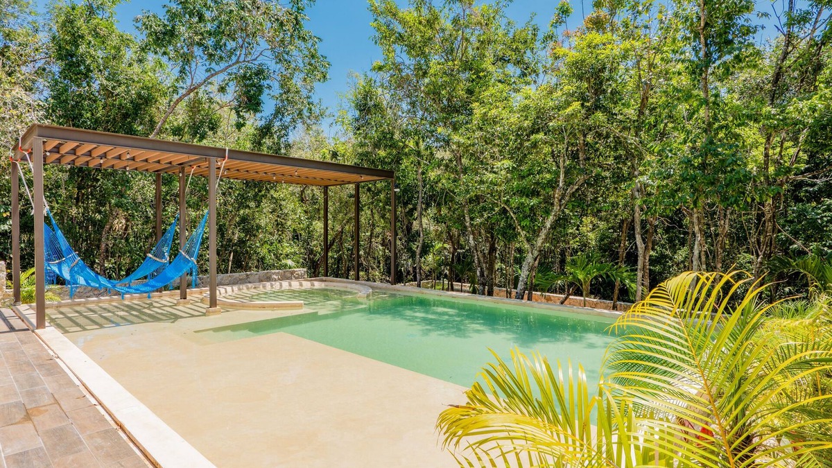 Xpu-Ha Apartment | Lower level apartment with high-speed internet pool, gym, & tennis courts