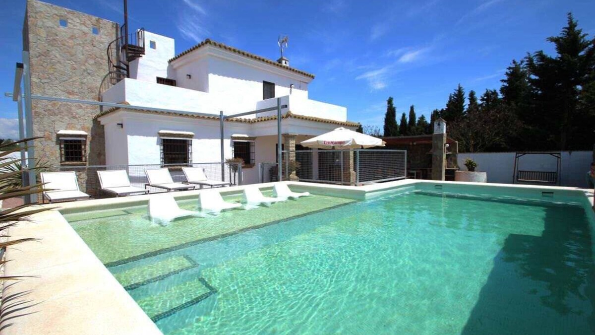 Conil de la Frontera House | luxurious villa in quiet surrounding for 6 guests with large pool and precious terraces and nice bbq-area and seaview in the distance