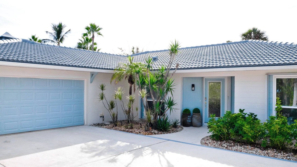 Holmes Beach House | Luxury ground, pet friendly - king suites, heated pool & hot tub - canal!