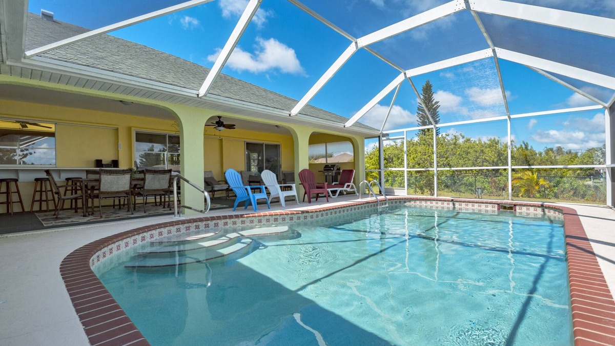 South Gulf Cove House | LUXURY WATERFRONT! WARM PRIVATE POOL! MIN TO BEACHES! WIFI! GRILL! BABY SUPPLIES