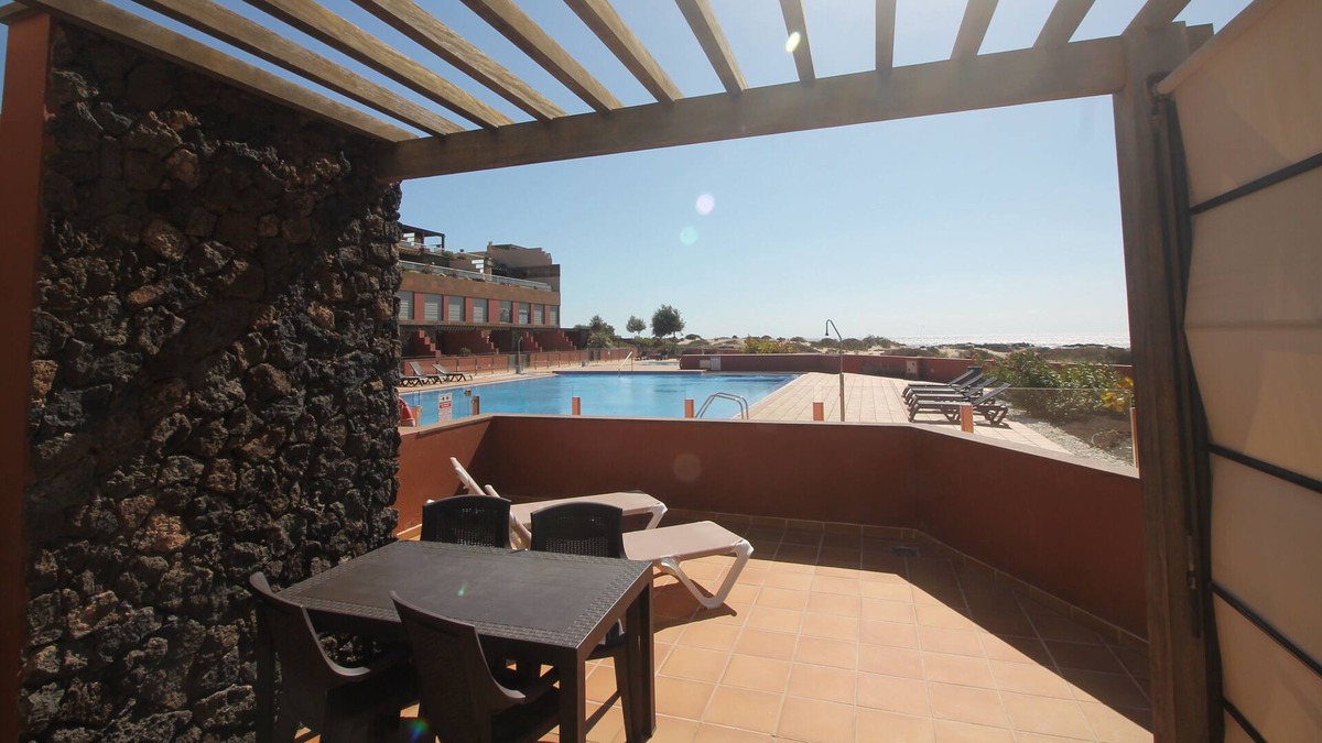 Los Lagos Apartment | Marfolin 1 El Cotillo. Beachfront apartment with direct access to pool & beach