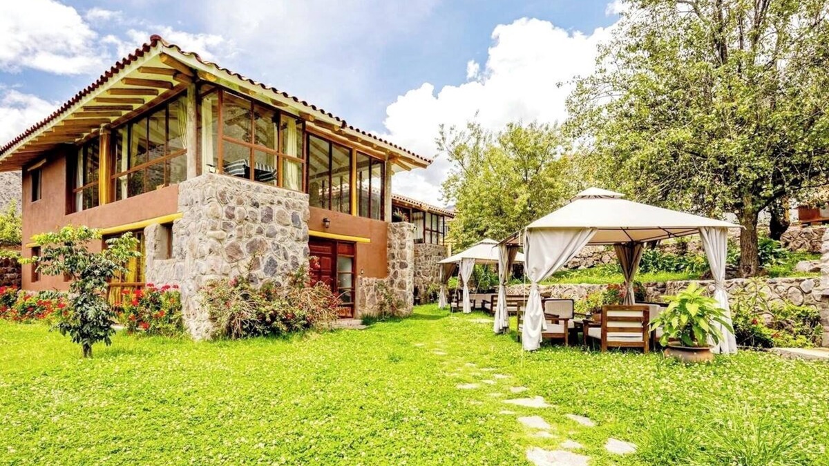 Huaran House | Modern and comfortable house with stunning views of the mountains and waterfall.