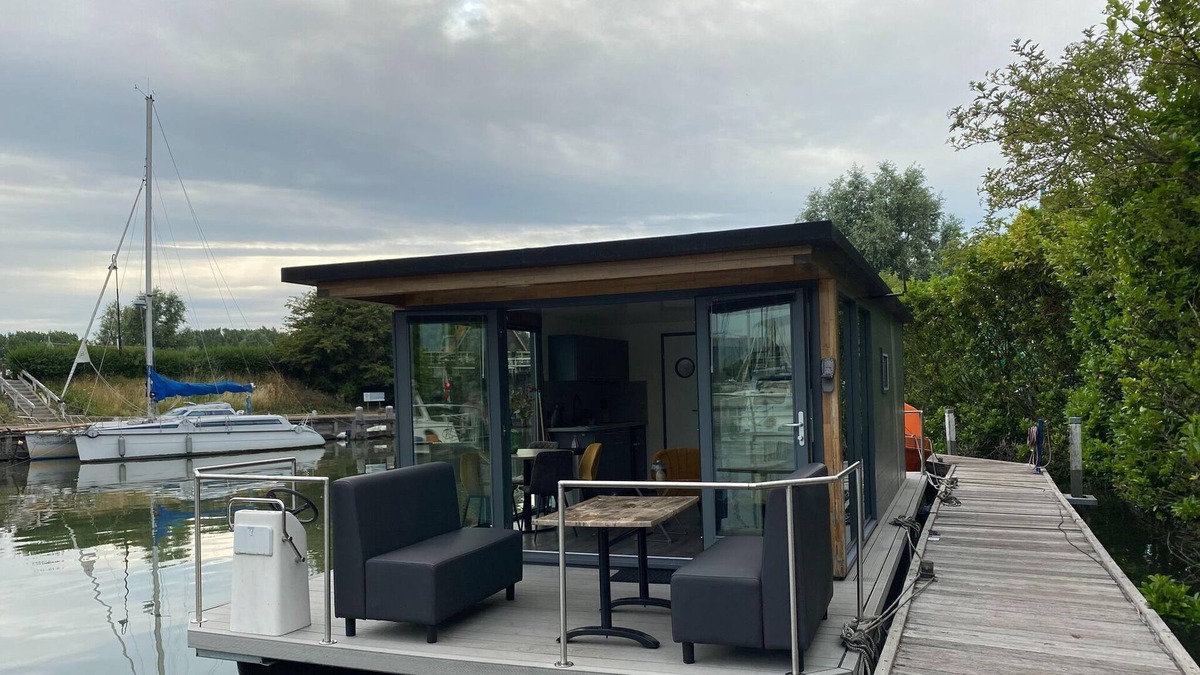 Monnickendam Boat Rental | Modern house boat in Monnickendam with jetty