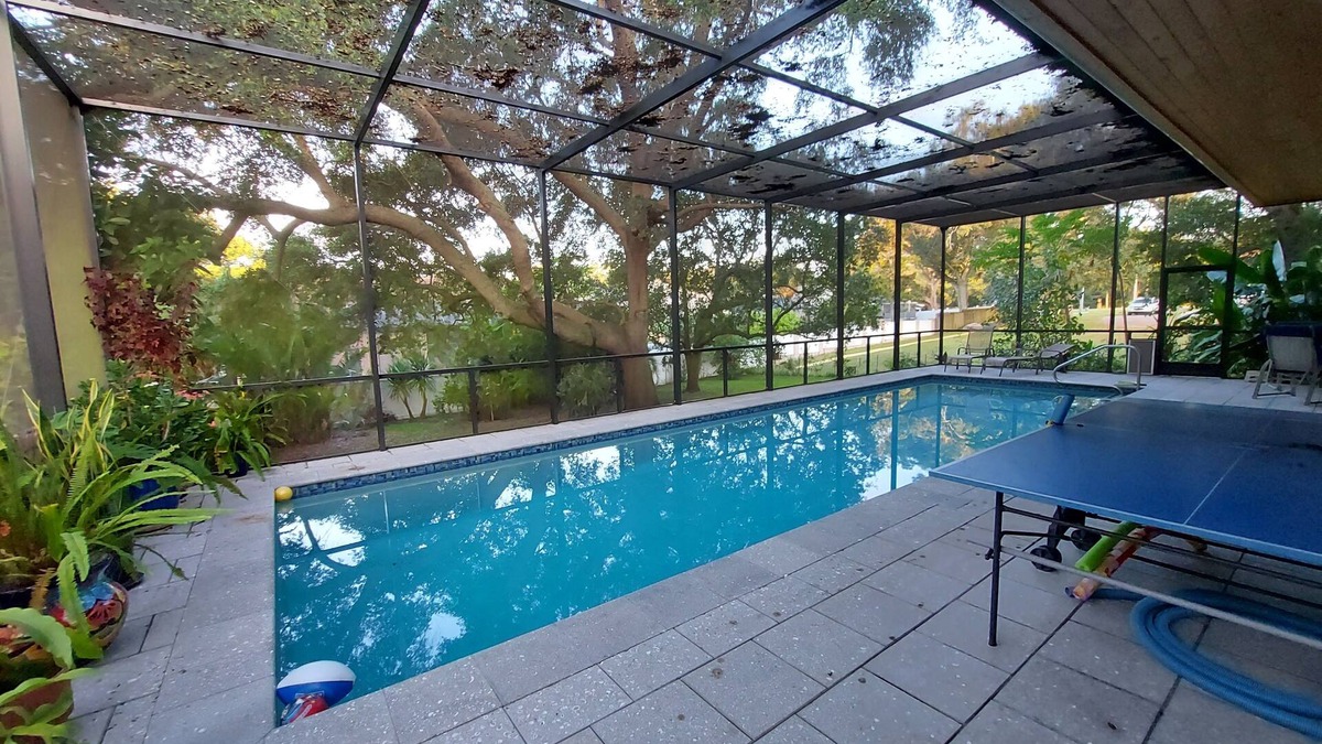 Palm Harbor House | Modern Jewel, 10 Min. drive to Honeymoon Island, Sleeps 4, Lap Pool, WorkoutRoom