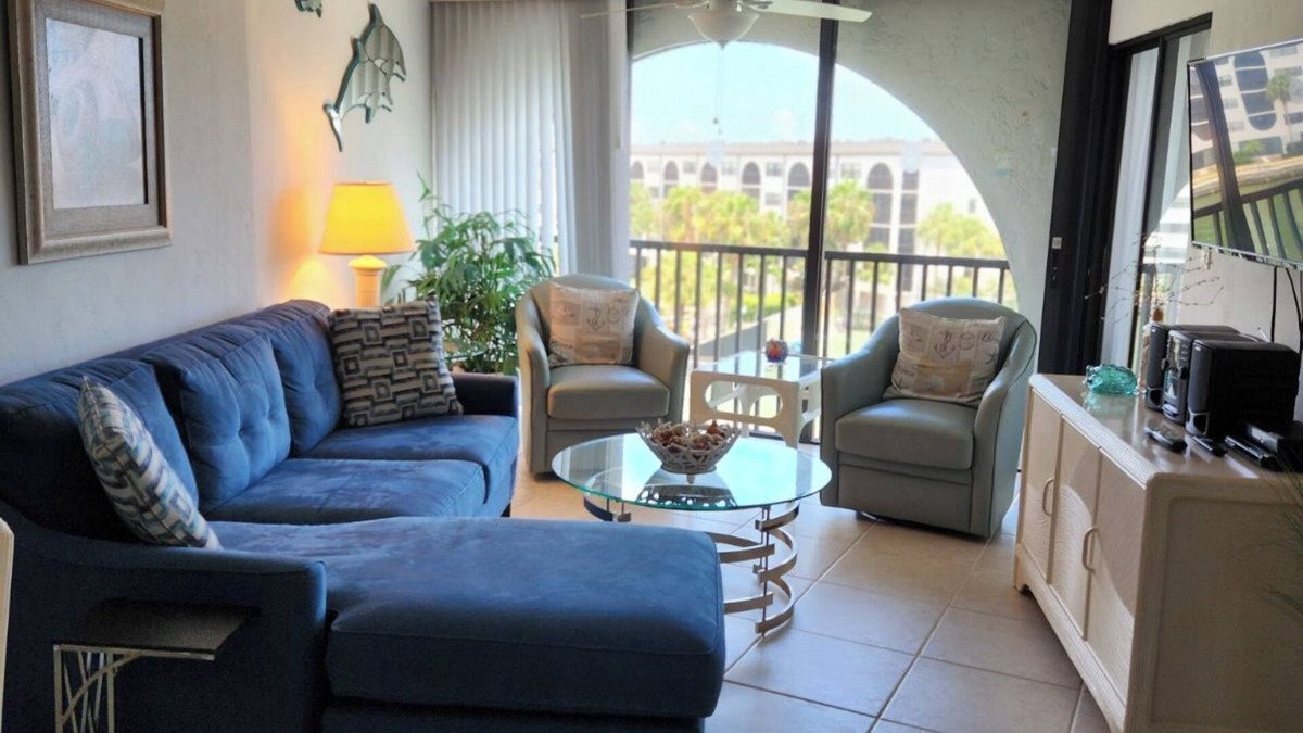 Marco Island Condo | Modern top floor with a beautiful view of the bay, pool, waterfront restaurant