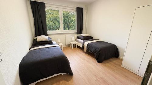 Stadtbezirk West Apartment | Monteurwohnungen mit TV, Internet, Parkplatz, Waschmaschine, Küche, Balkon, Restaurants und Supermarkt