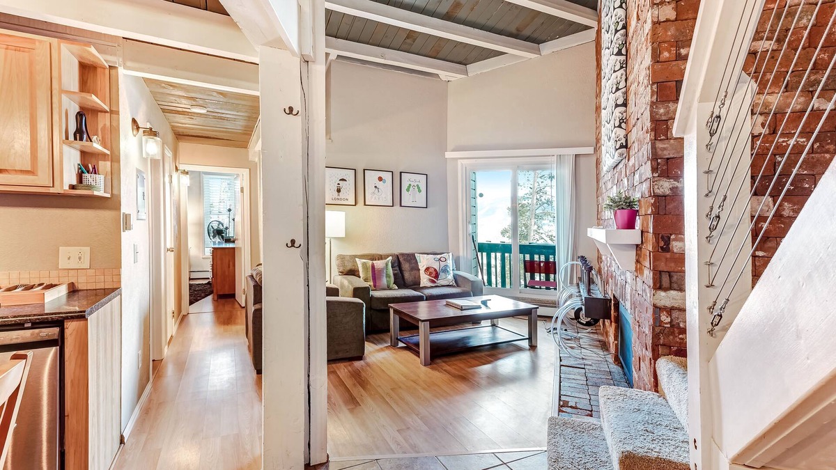 Wildernest Condo | Mountain view condo w/skylit loft, balcony, shared pool, hot tub & game room