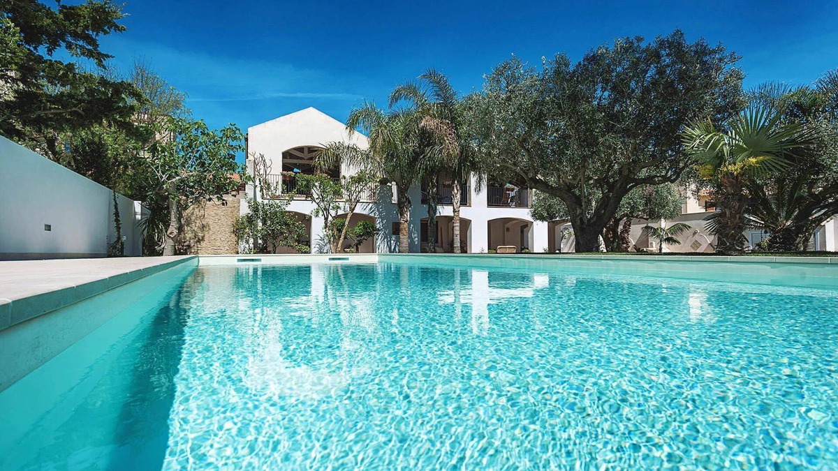 Marsala House | My Rental Homes - Casa Tika with shared pool surrounded by a wonderful garden
