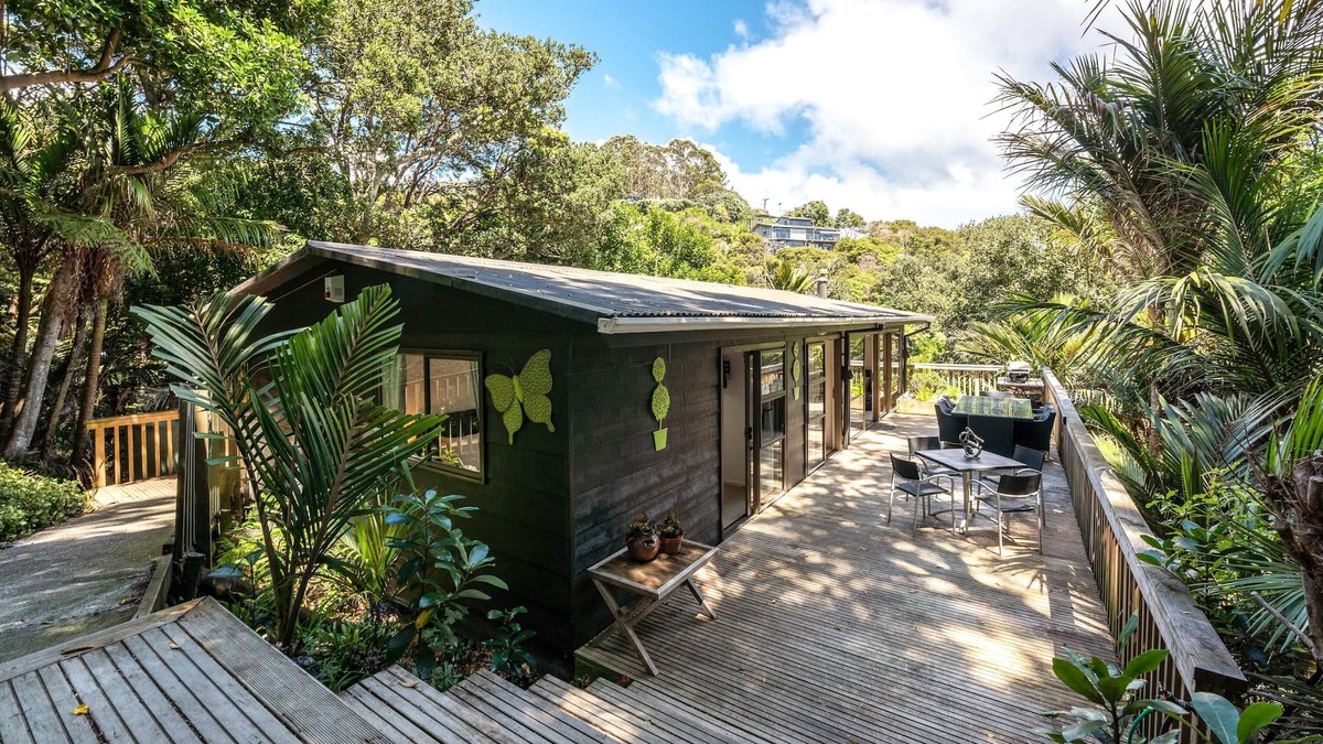 Onetangi Cottage | Near Onetangi beach, Treetops is a family bach on the edge of the forest.