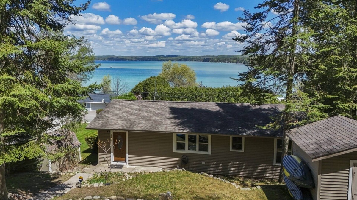 Rapid City House | NEW! Beautiful Torch Lake House with Beach Access