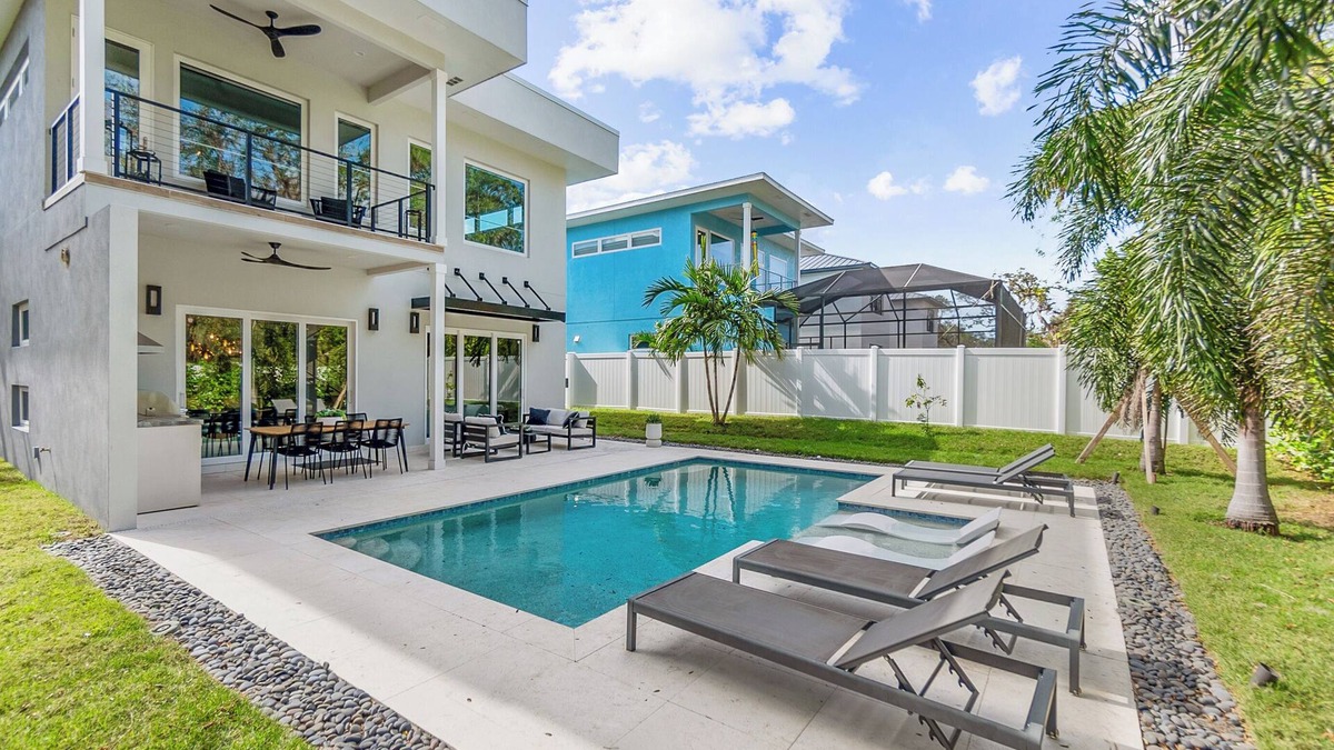 Ridge Wood Heights House | New modern home with salt water heated pool located minutes from SiestaKey Beach