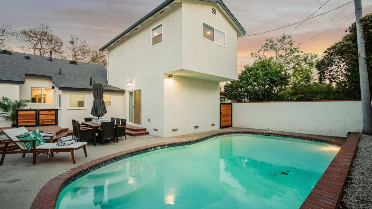 The Plaza House | *New* modern pool home + 5 mi to beach + sleeps 14