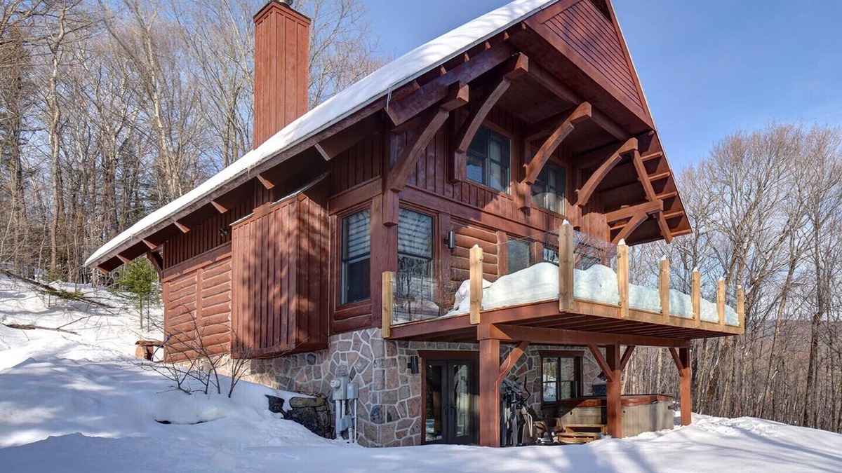Lac Superieur Village Ski Chalet | Newly renovated log home with private spa and lake access.