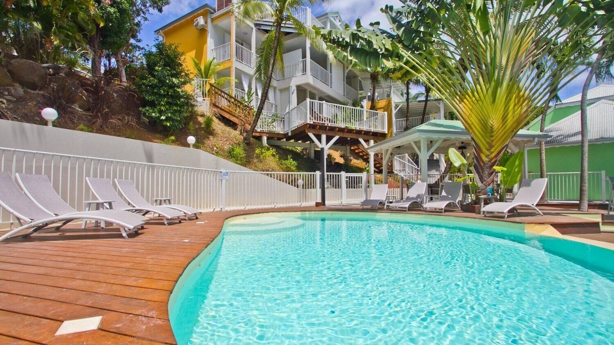 Deshaies Apartment | "O Coeur de Deshaies", Papaya Duplex. Room with sea view. A/C, swimming pool.