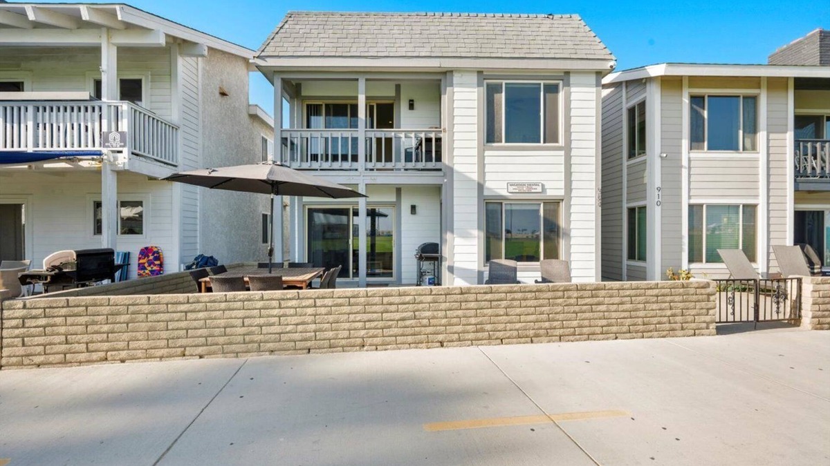 Balboa Peninsula Apartment | Oceanfront Boardwalk property, Newly remodeled Large patio, Steps to the sand.