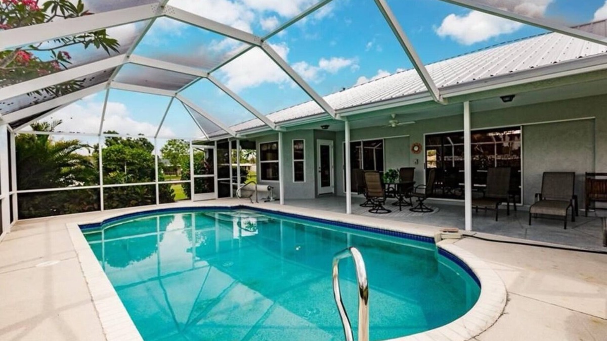 Fort Myers House | Offering breathtaking views of the sun setting over the water.