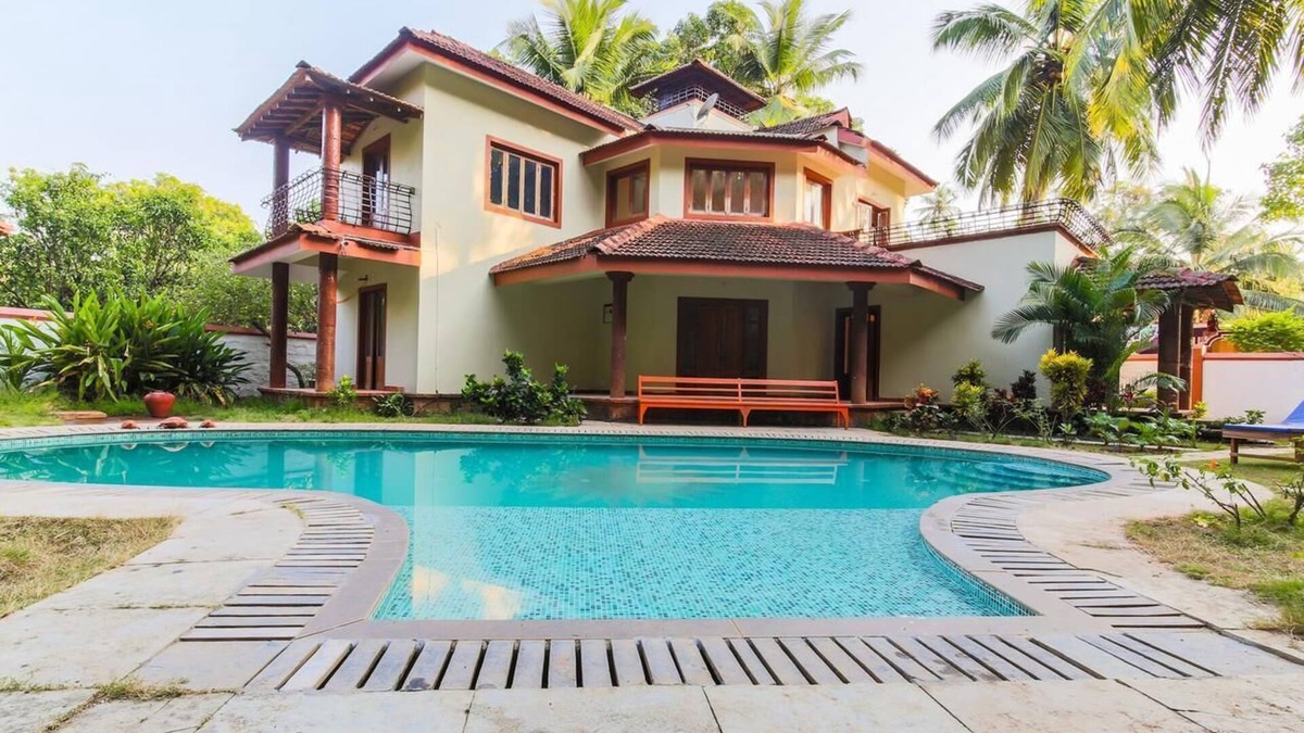 Morjim House | Outdoor Pool with Classic Bedroom in Goa