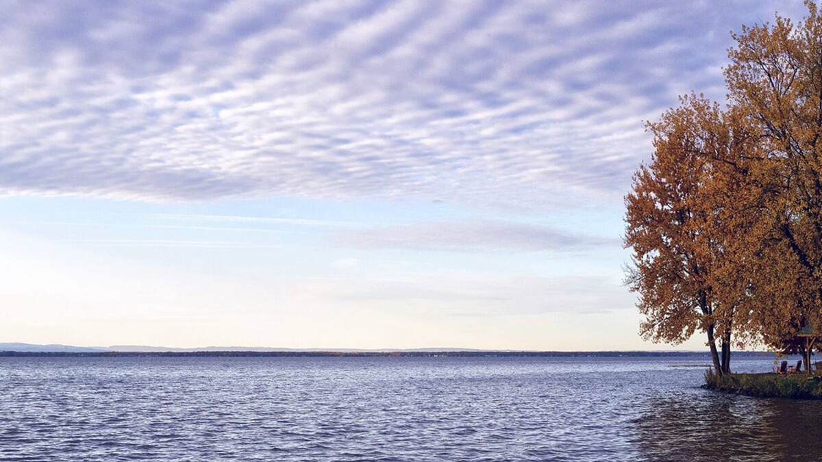 Bernhards Bay Cottage | Peaceful couples retreat on Oneida Lake. Insta-worthy views. Cozy interior.