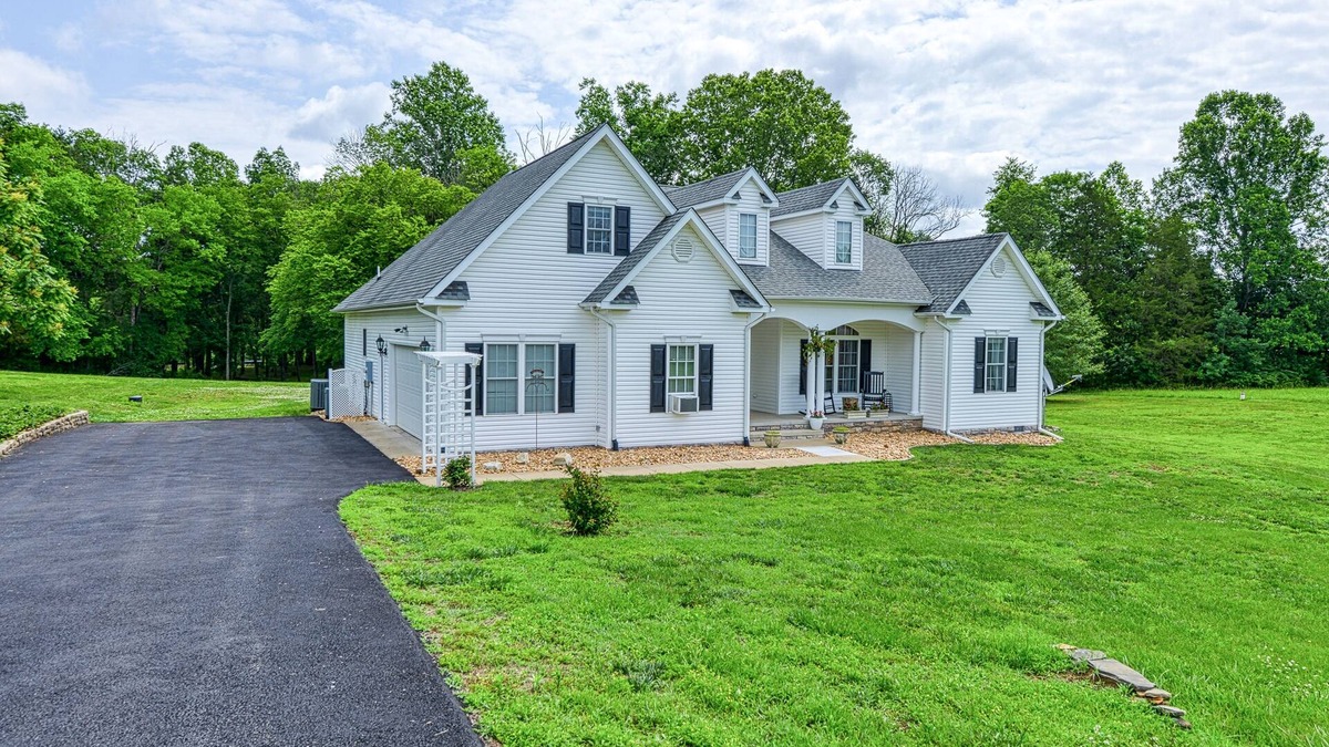 Livingston House | Peaceful lakeside retreat with hot tub, private pool, dock & paddle boards
