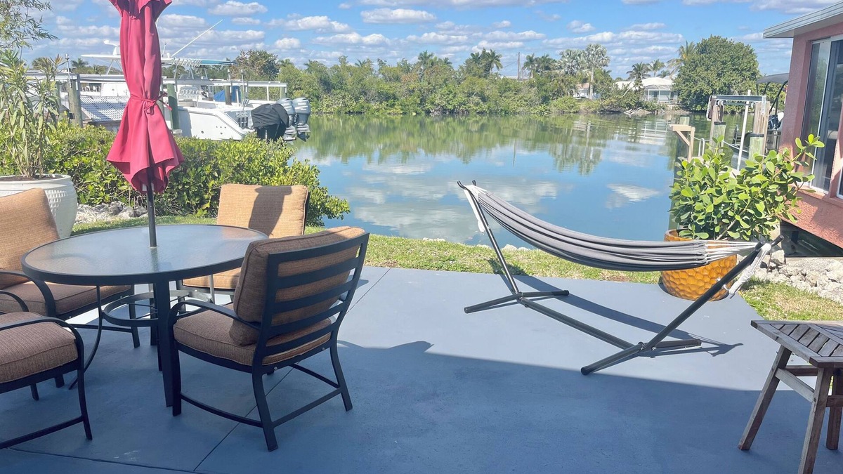 Isles of Capri Apartment | Peaceful Waterfront Efficiency~Dolphins, Manatees and Island Vibes