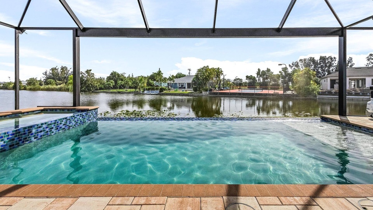 Burnt Store House | Private Beach with volleyball, Saltwater pool & spa - Villa Siren Calling - Roelens Vacations